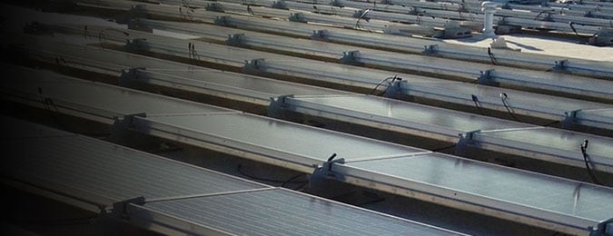 An image of solar panels on the roof of a building